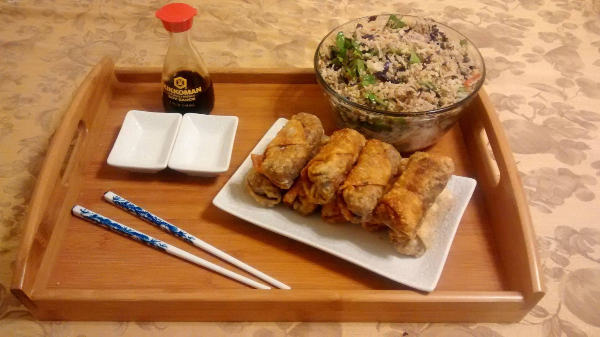 Tray Of Egg Rolls And Fried Rice Background