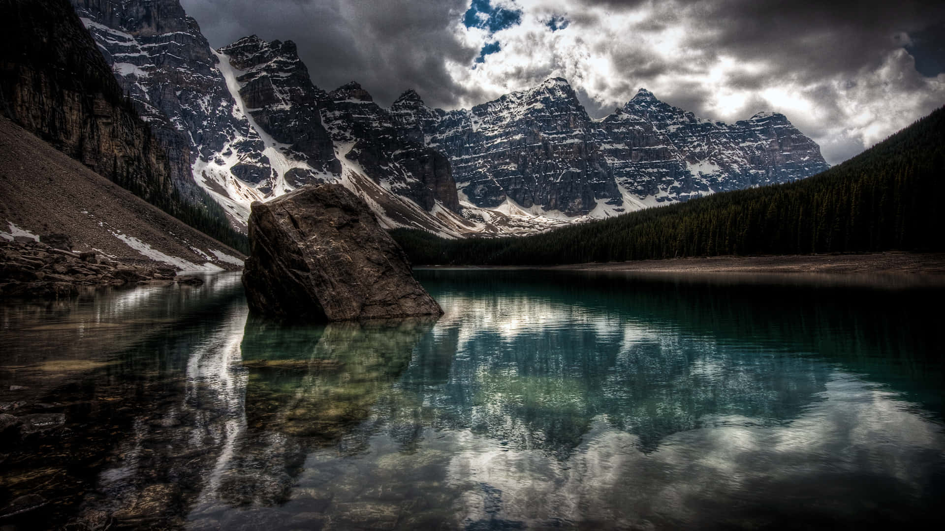 Tremendous Rock In Lake Background
