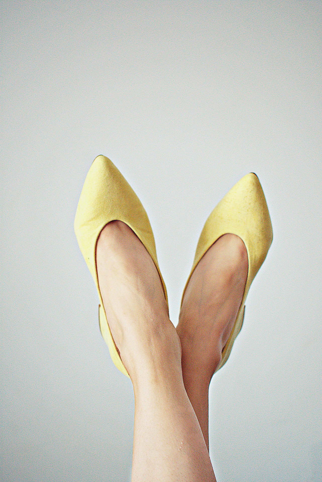 Trendy Feet In Bright Yellow Shoes