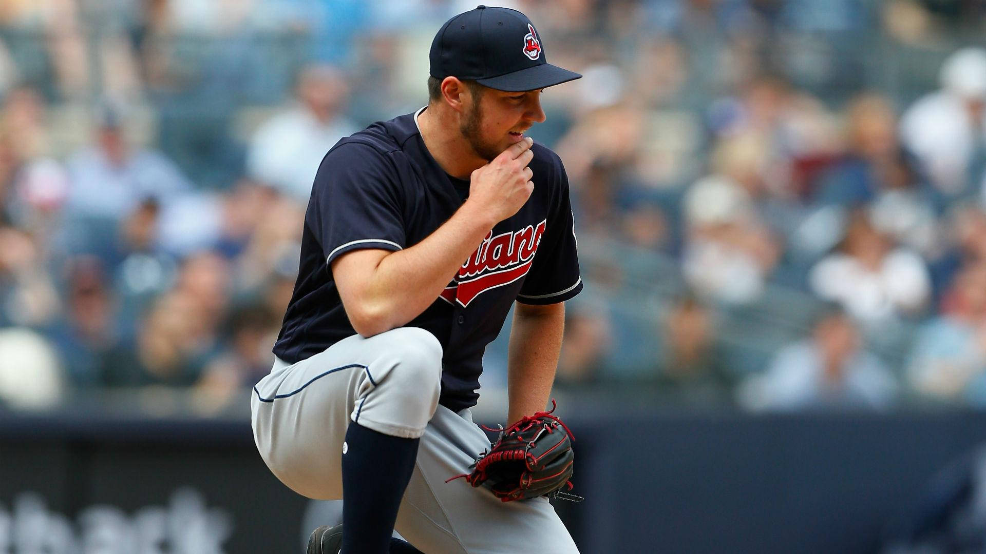 Trevor Bauer Crouching During A Game Background