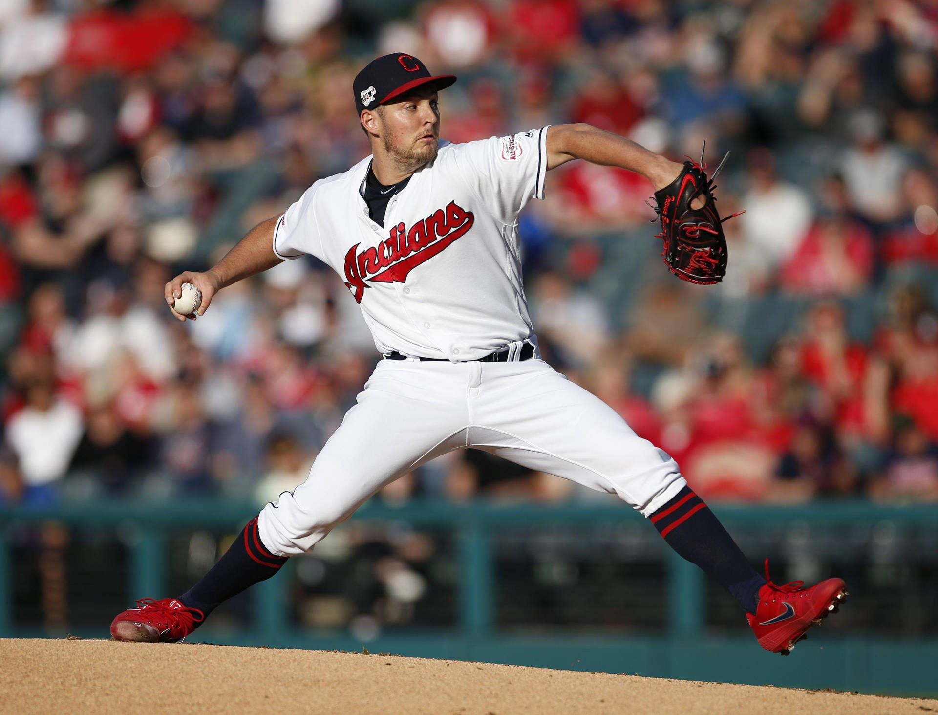 Trevor Bauer In Indians Outfit Jumping Background