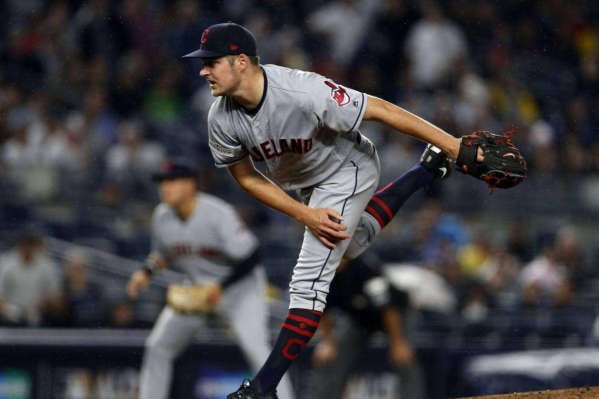 Trevor Bauer Leaning Forward With Foot Raised Background