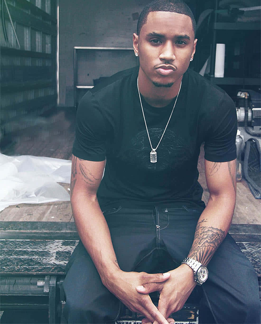 Trey Songz Poses With His Shimmery Gray Jacket Background