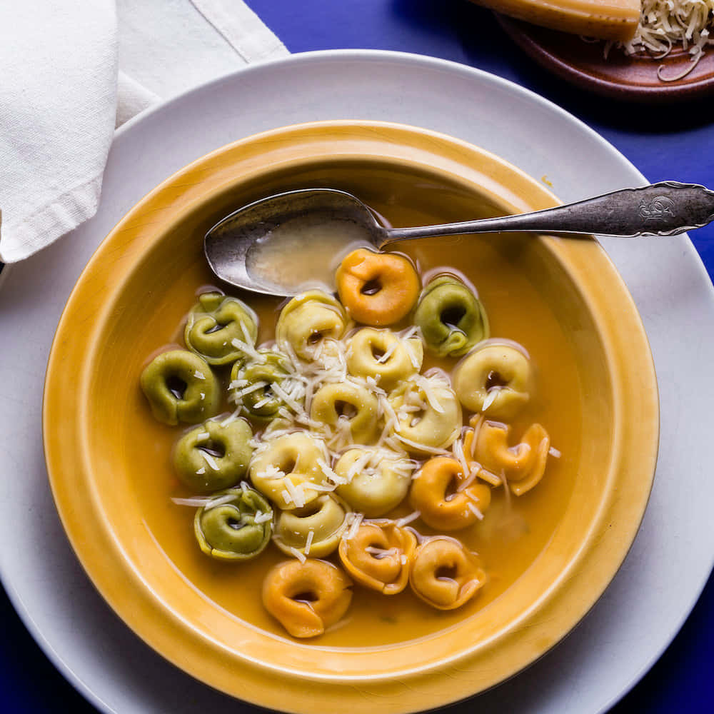 Tri-color Tortellini In Brodo Background