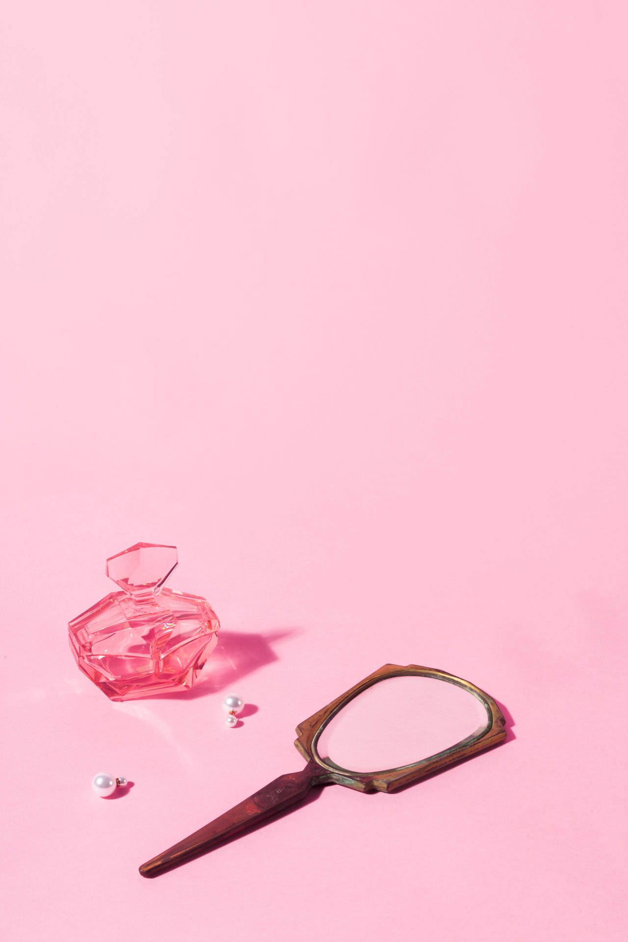 Trinkets On A Pink Color Background