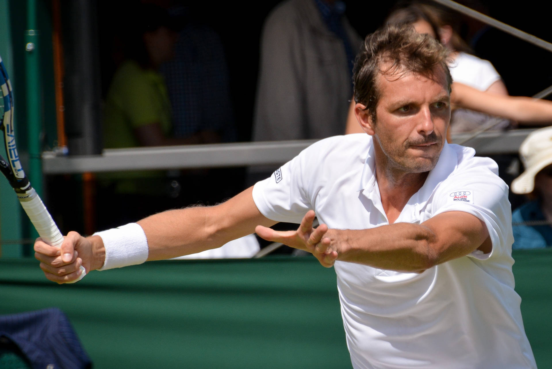 Triumph On Tennis Court: Julien Benneteau Celebrating A Victory Background