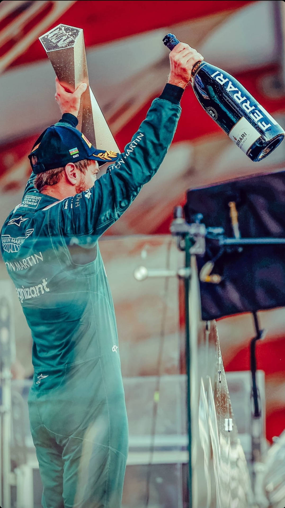 Triumphing Sebastian Vettel Celebrating His Victory Background