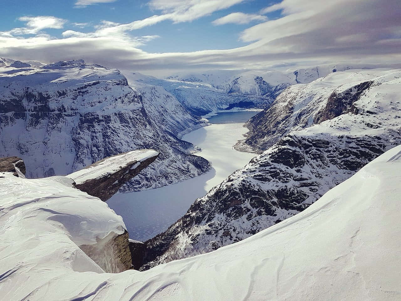 Trolltunga During Winter With Thick Snow Background