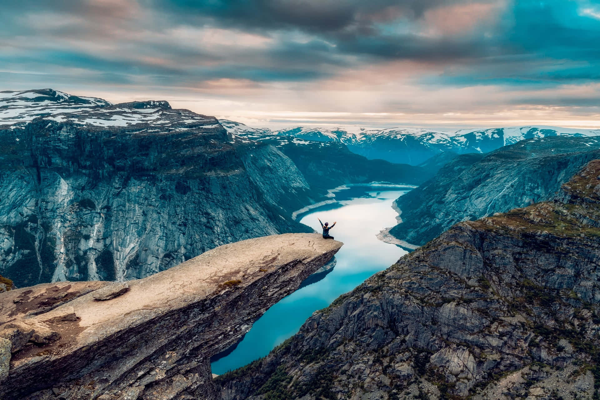 Trolltunga Under The Dark Clouds Background