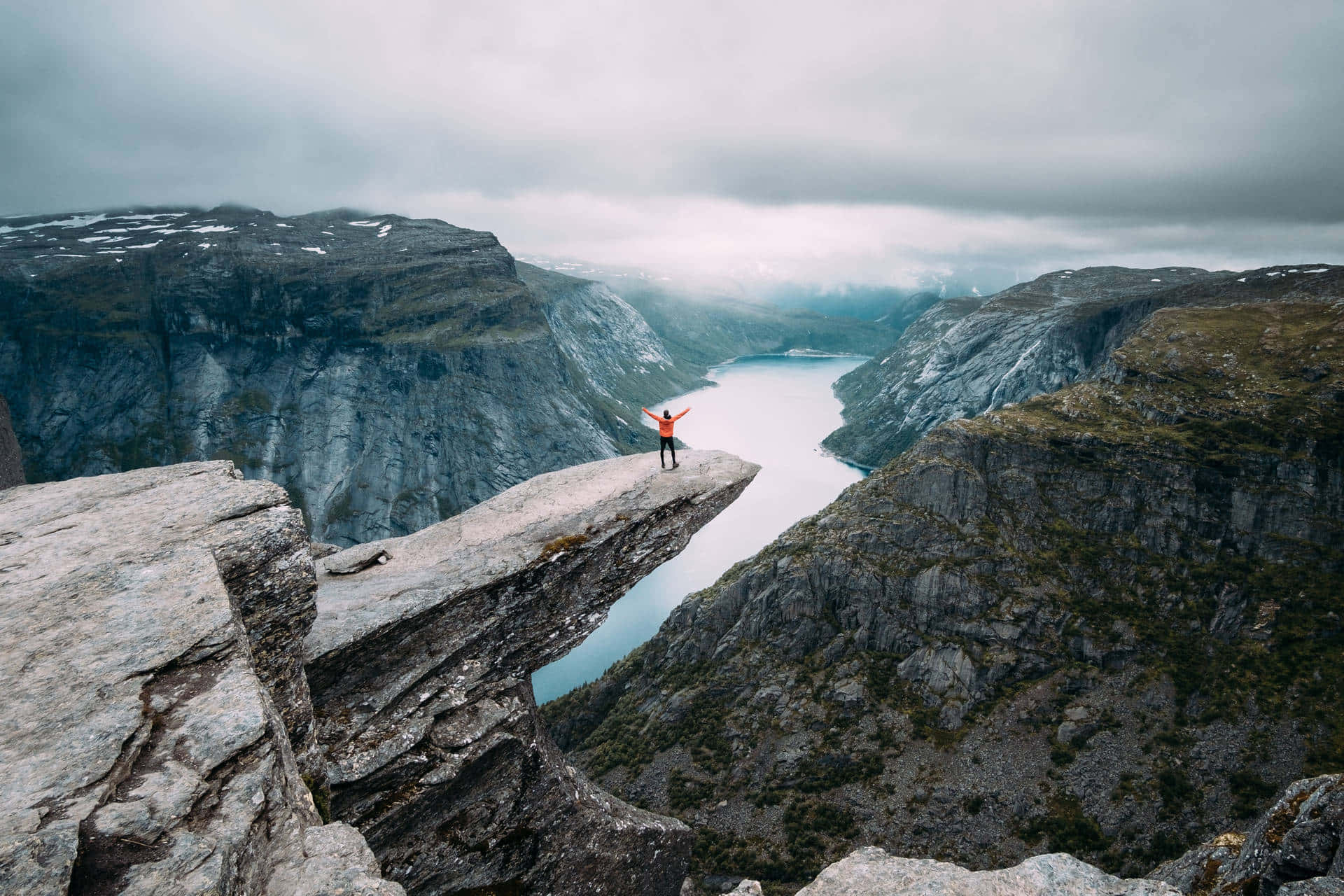 Trolltunga With Dark Grey Rocks Background