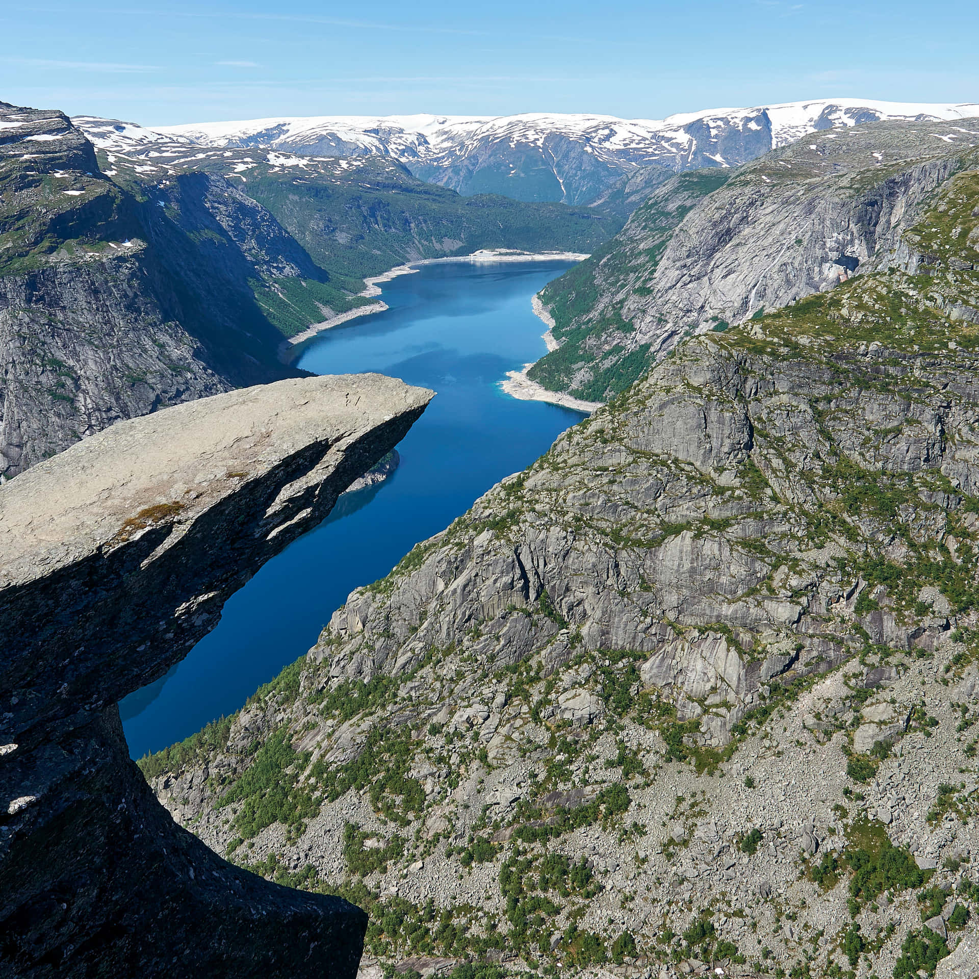 Trolltunga With Patches Of Grass Background