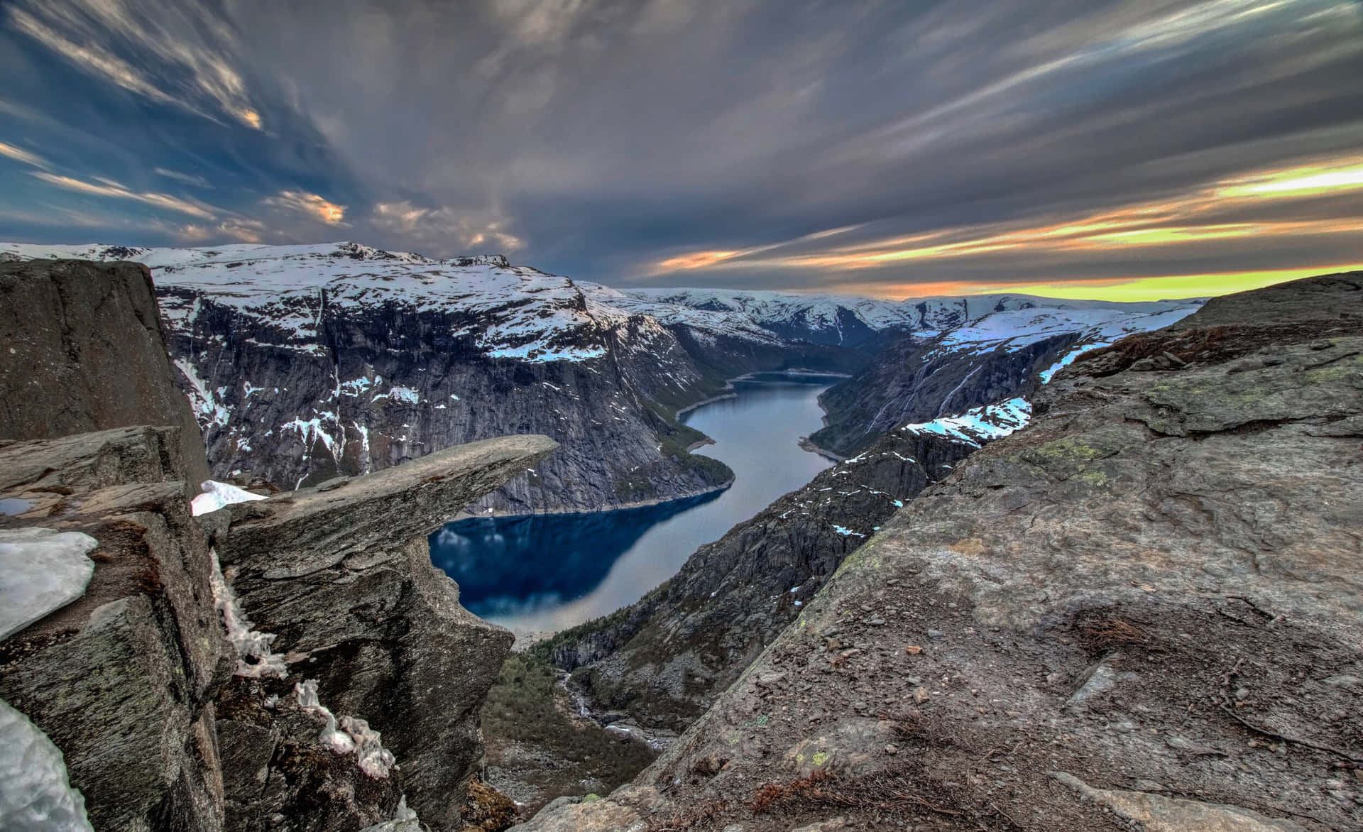Trolltunga With Rock Formations Background