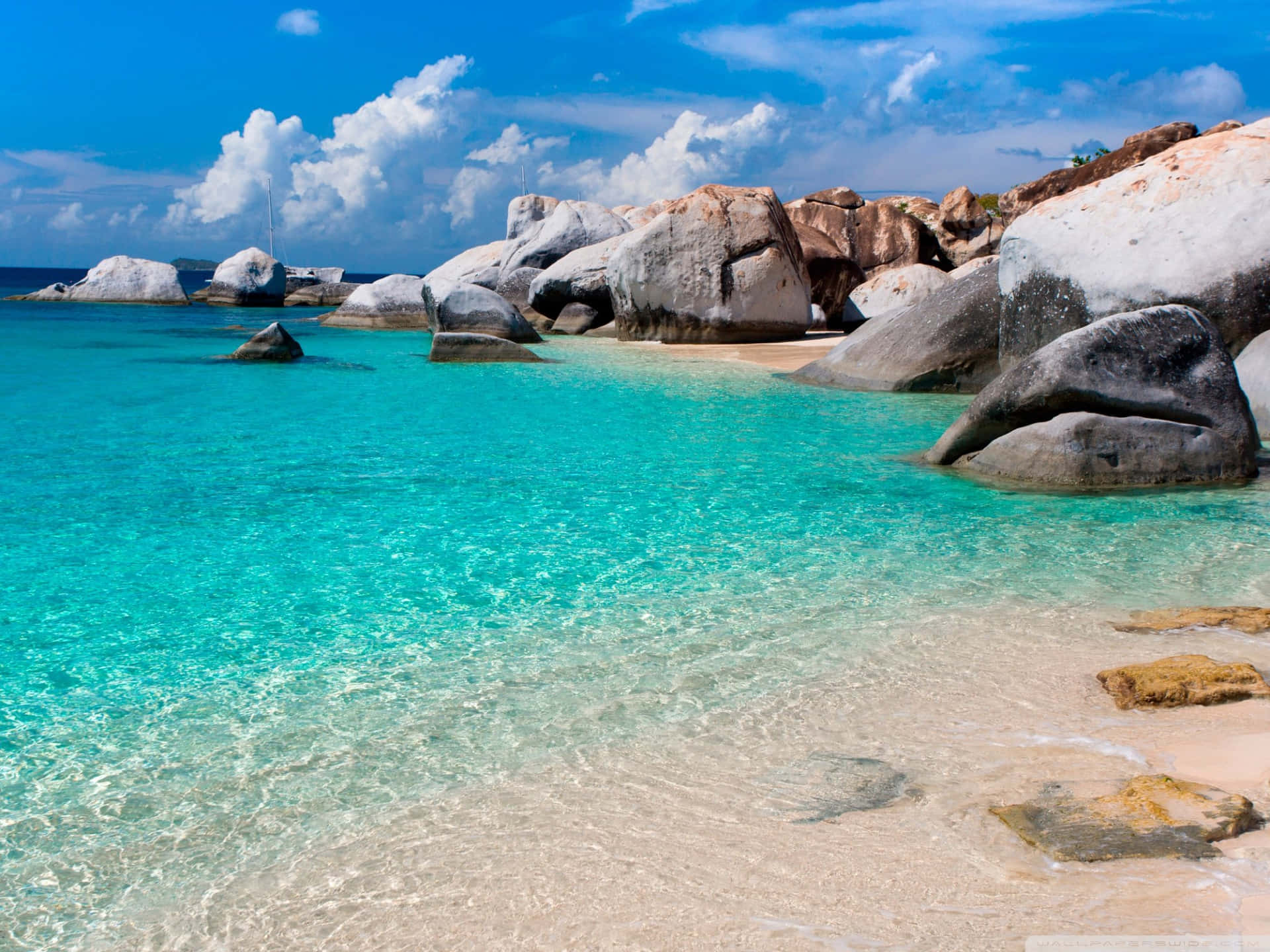 Tropical Beach With Stunning Rock Formation Background