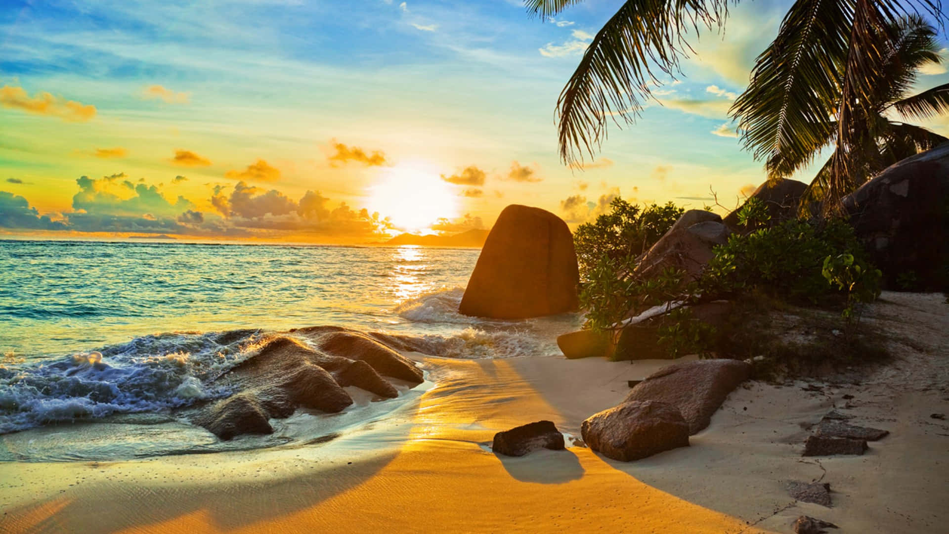 Tropical Sunset Rocky Beach Background