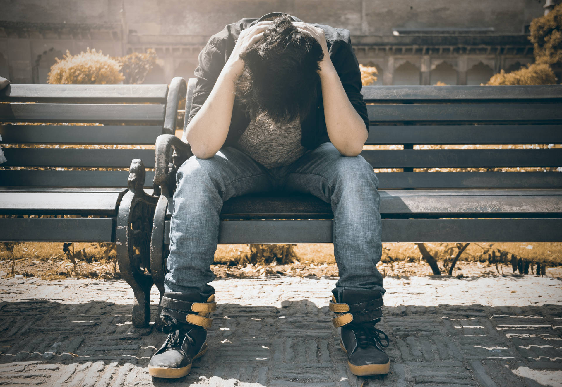 Troubled Man Sitting Alone Background