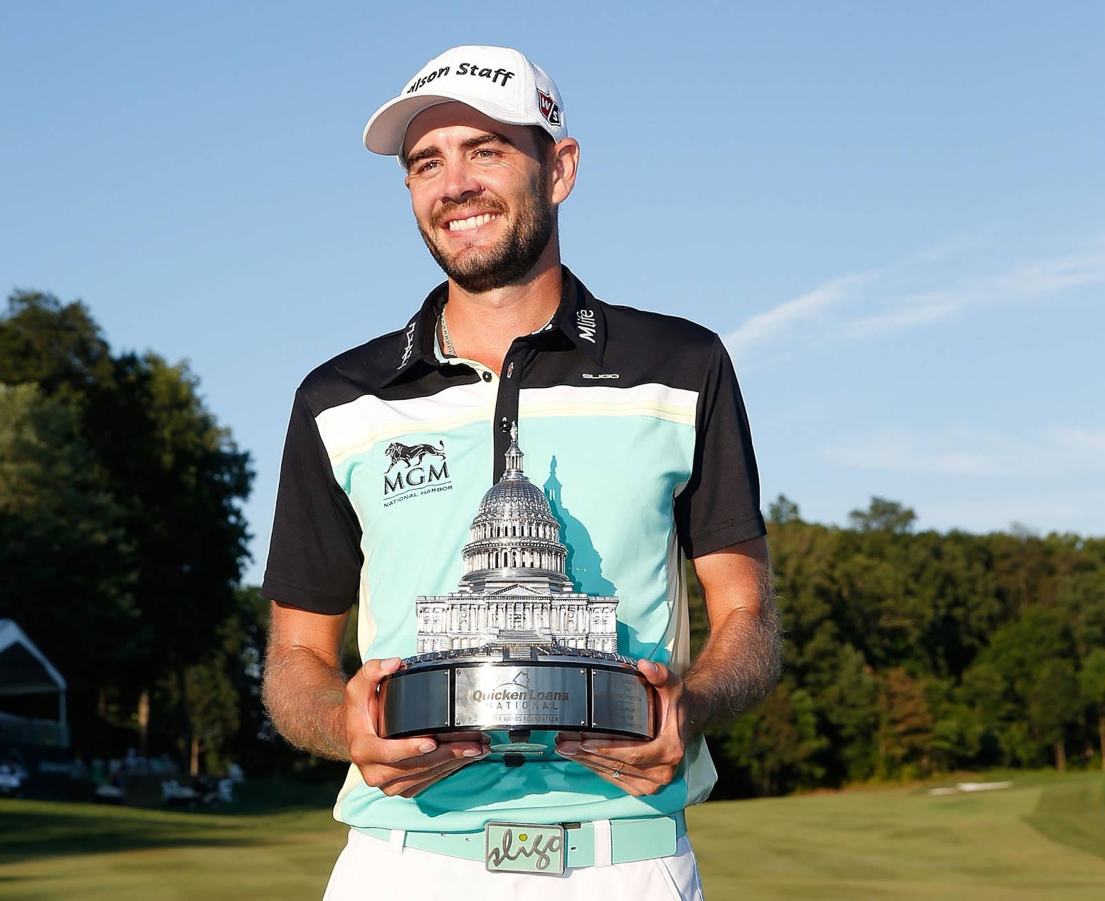 Troy Merritt Holding Trophy Proudly Background