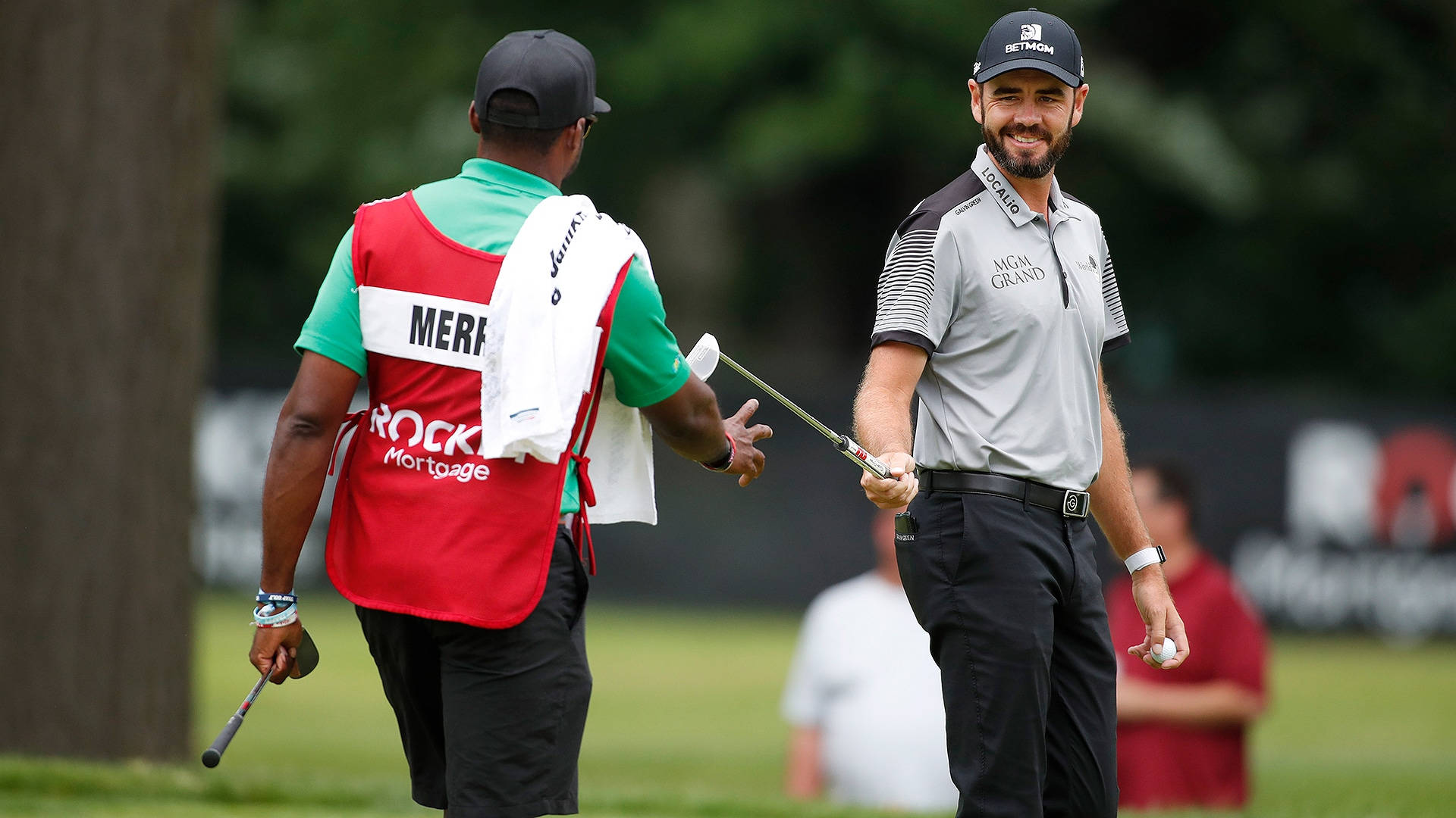 Troy Merritt Smiling At A Caddie Background