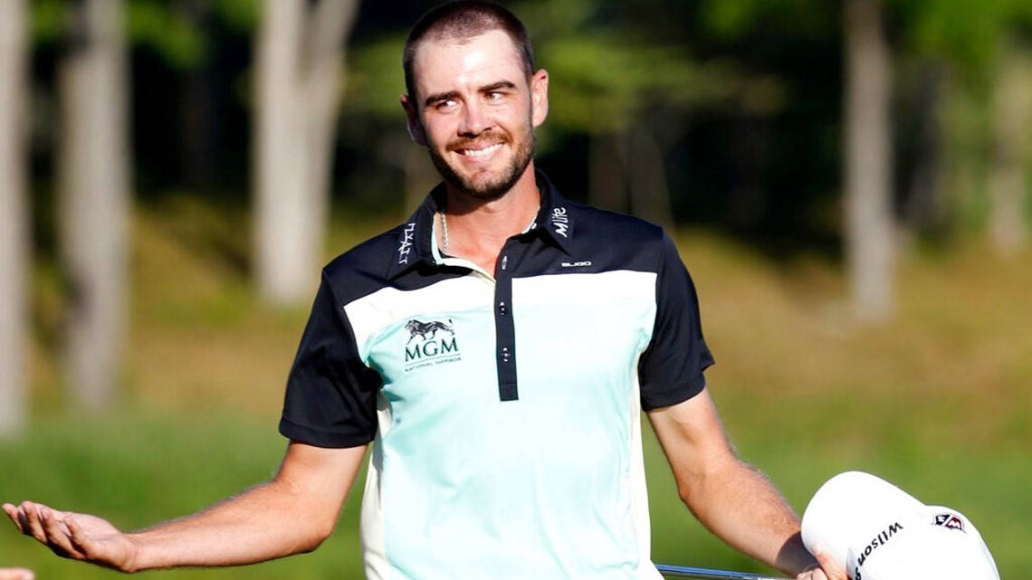 Troy Merritt Swinging In Action At A Golf Tournament Background