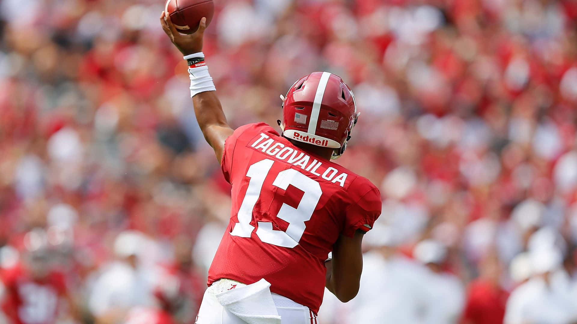 Tua Tagovailoa Celebrates His Return To The Field Background