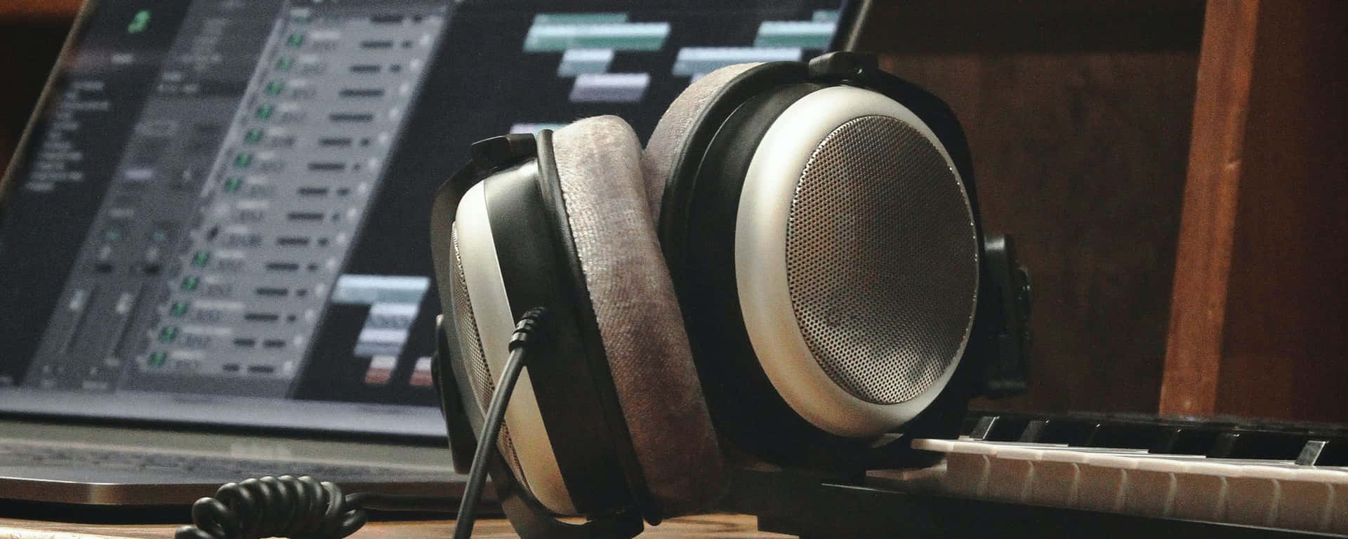 Tune-in And Turn-on With Headphones And Laptop. Background