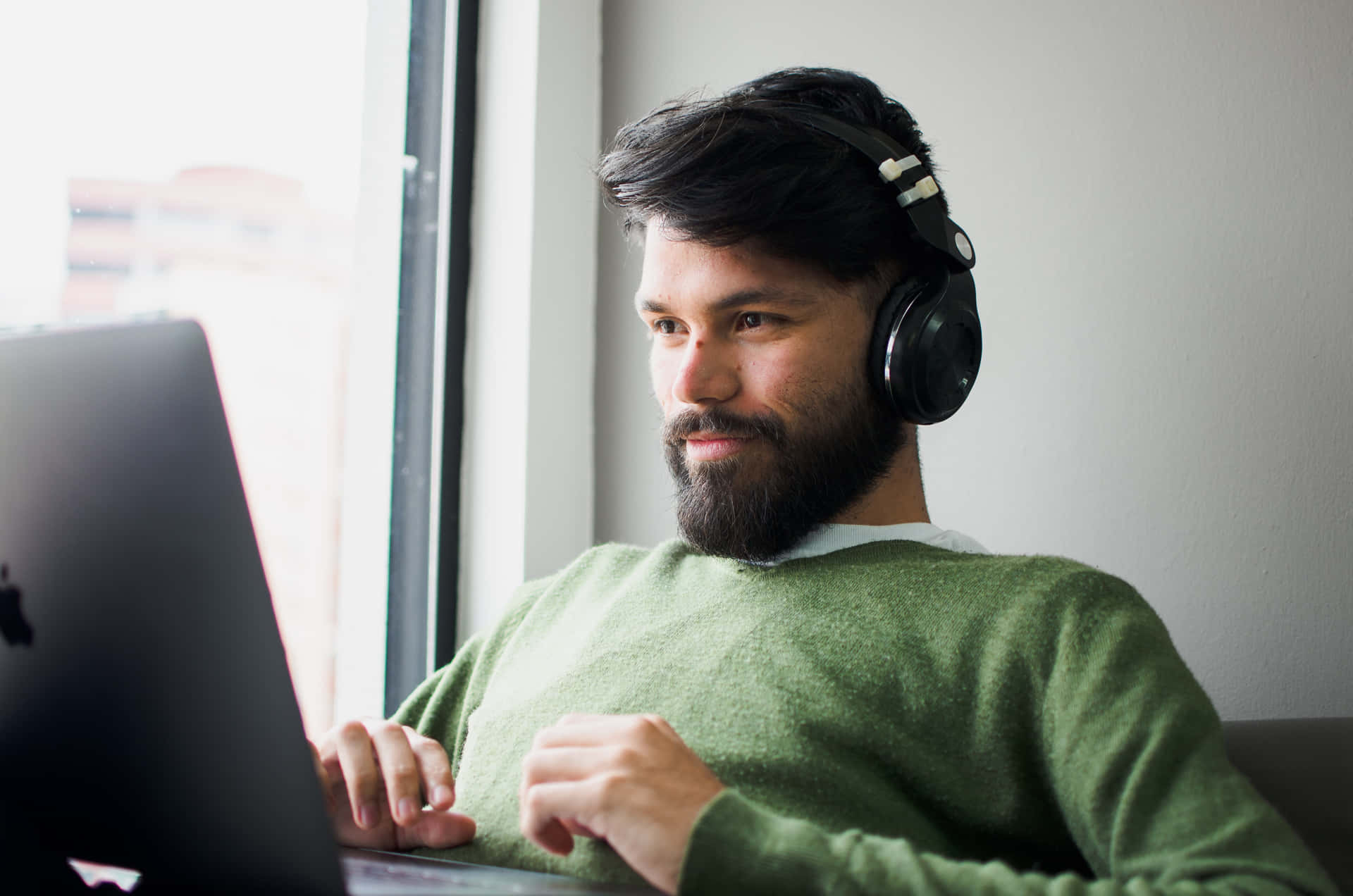 Tune In To Your Work With Headphones And Laptop Background