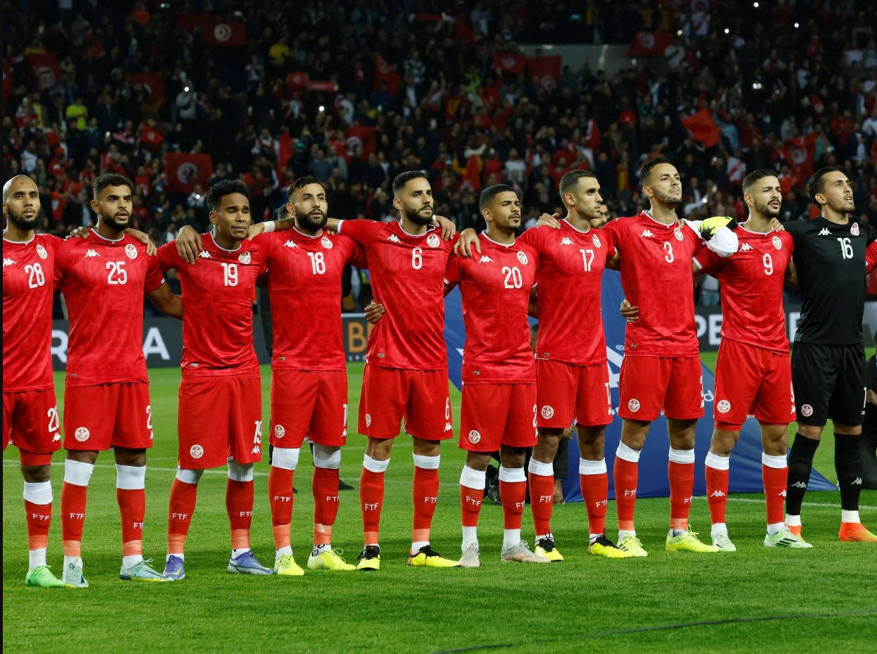 Tunisia National Football Team Players In Red Jersey Background