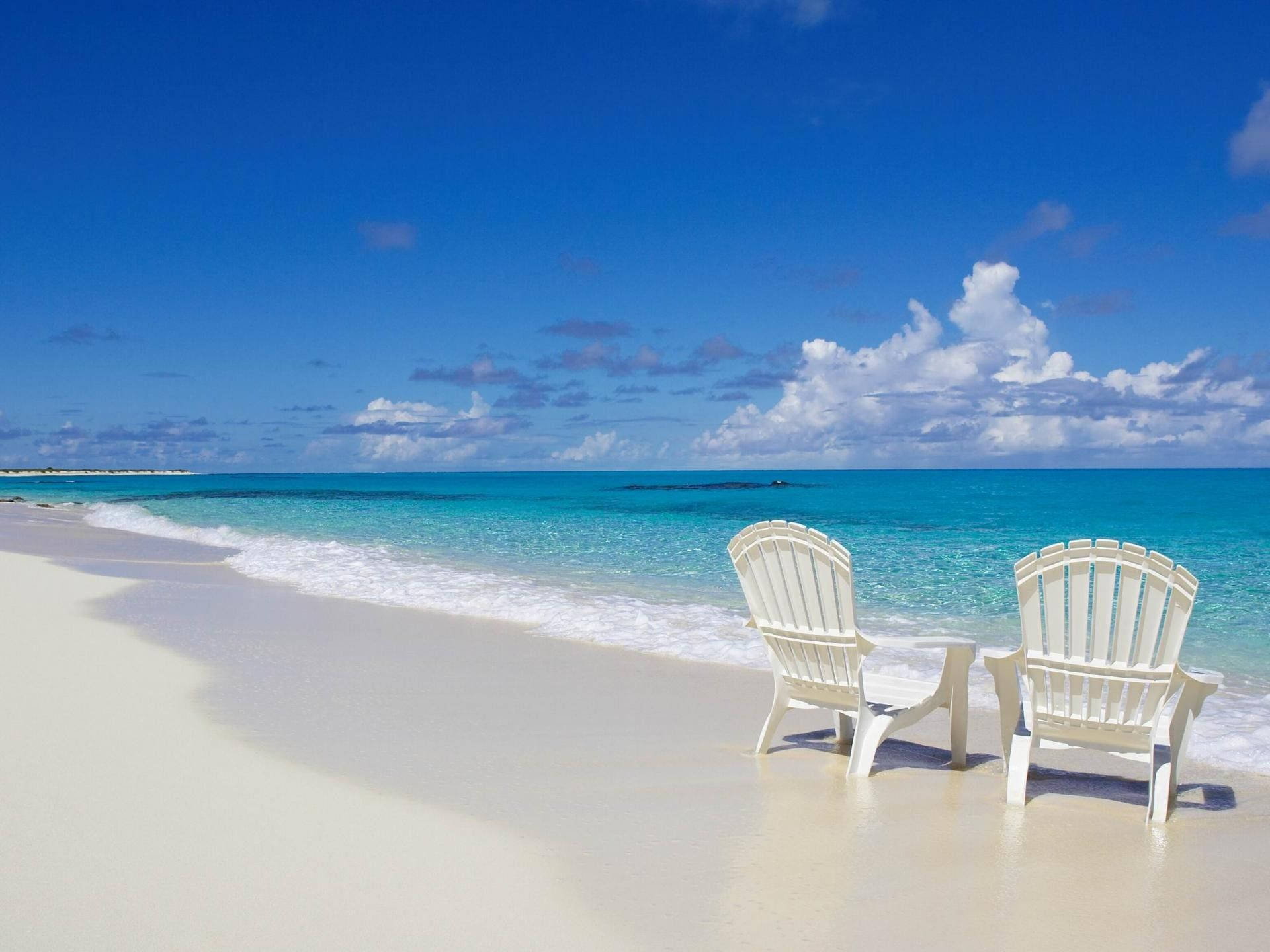 Turks And Caicos White Beach Chairs Background