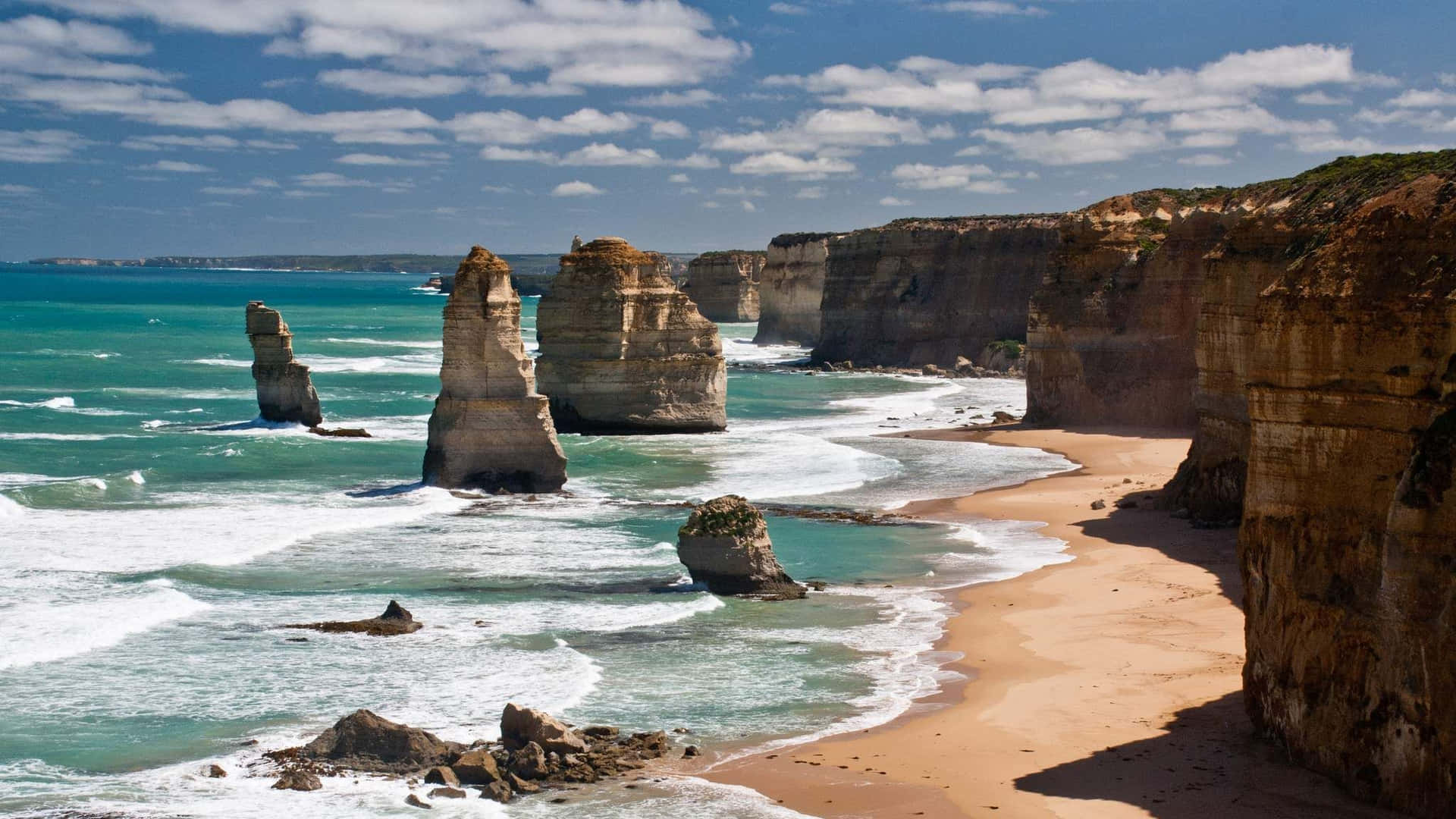Twelve Apostles In Victoria Australia During Cloudy Day Background
