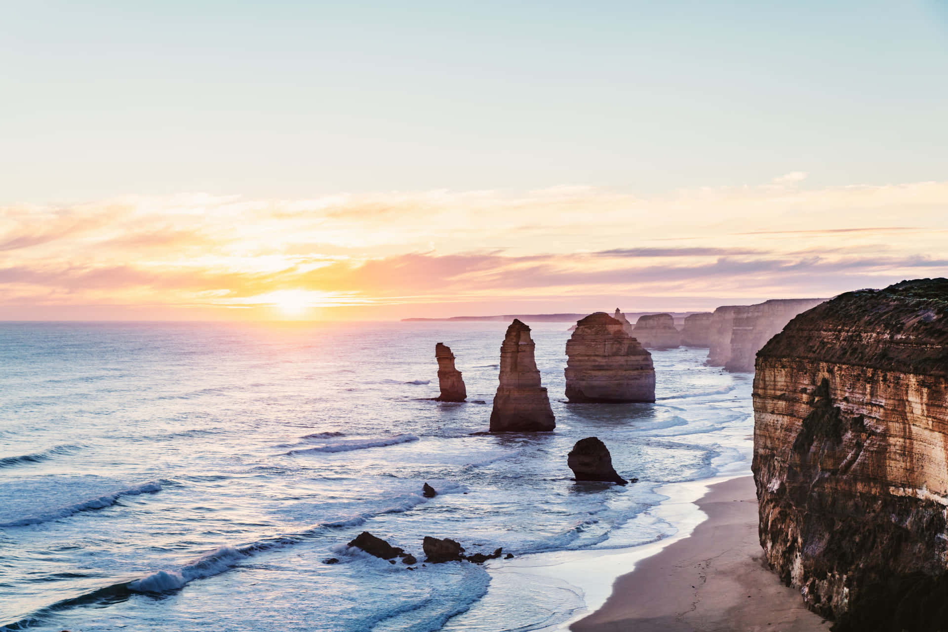 Twelve Apostles In Victoria Australia During Sunrise Background