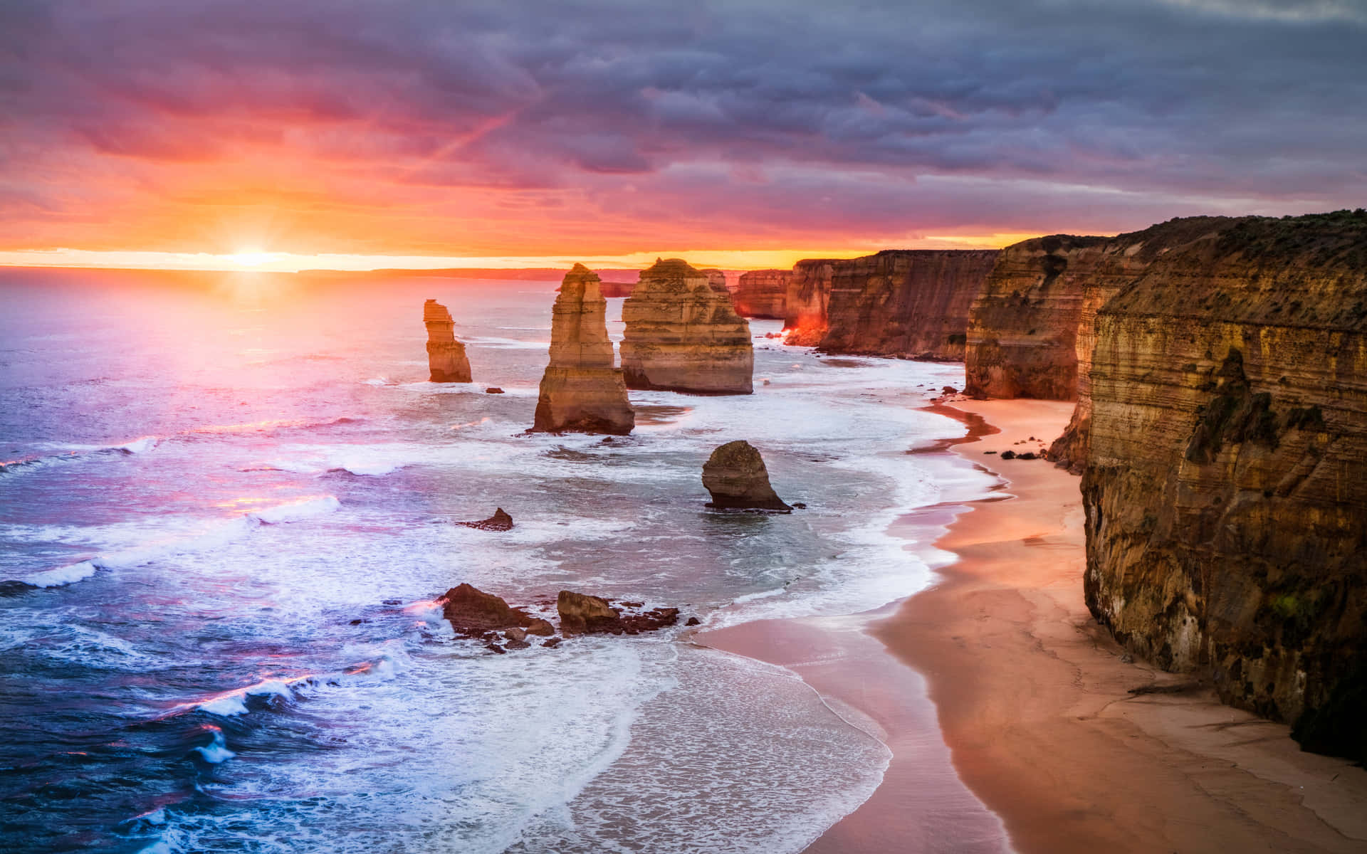Twelve Apostles In Victoria Australia During Sunset Background