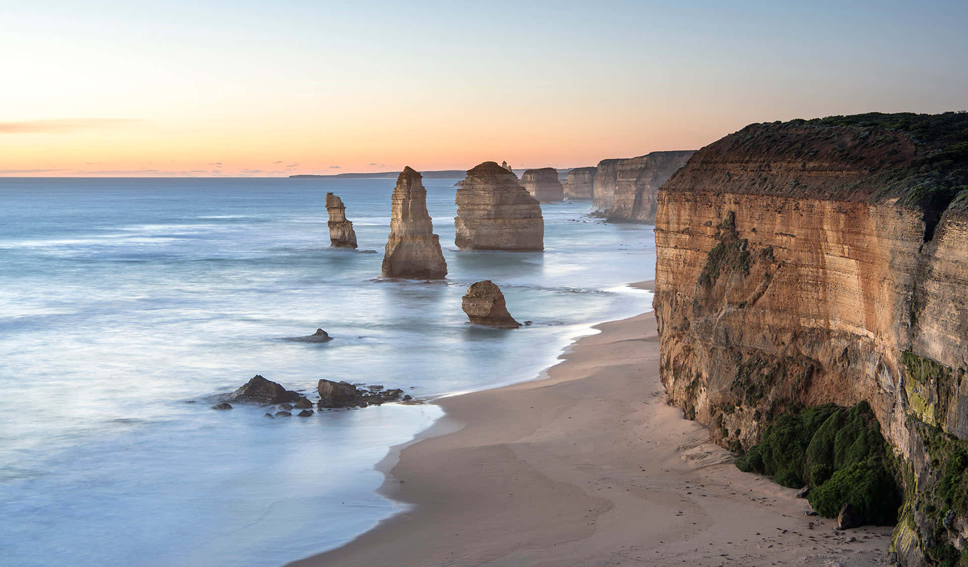 Twelve Apostles In Victoria Australia With Orange Horizon Background