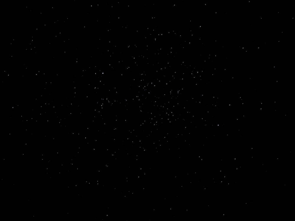 Twinkling Stars On Blank Black Sky Background