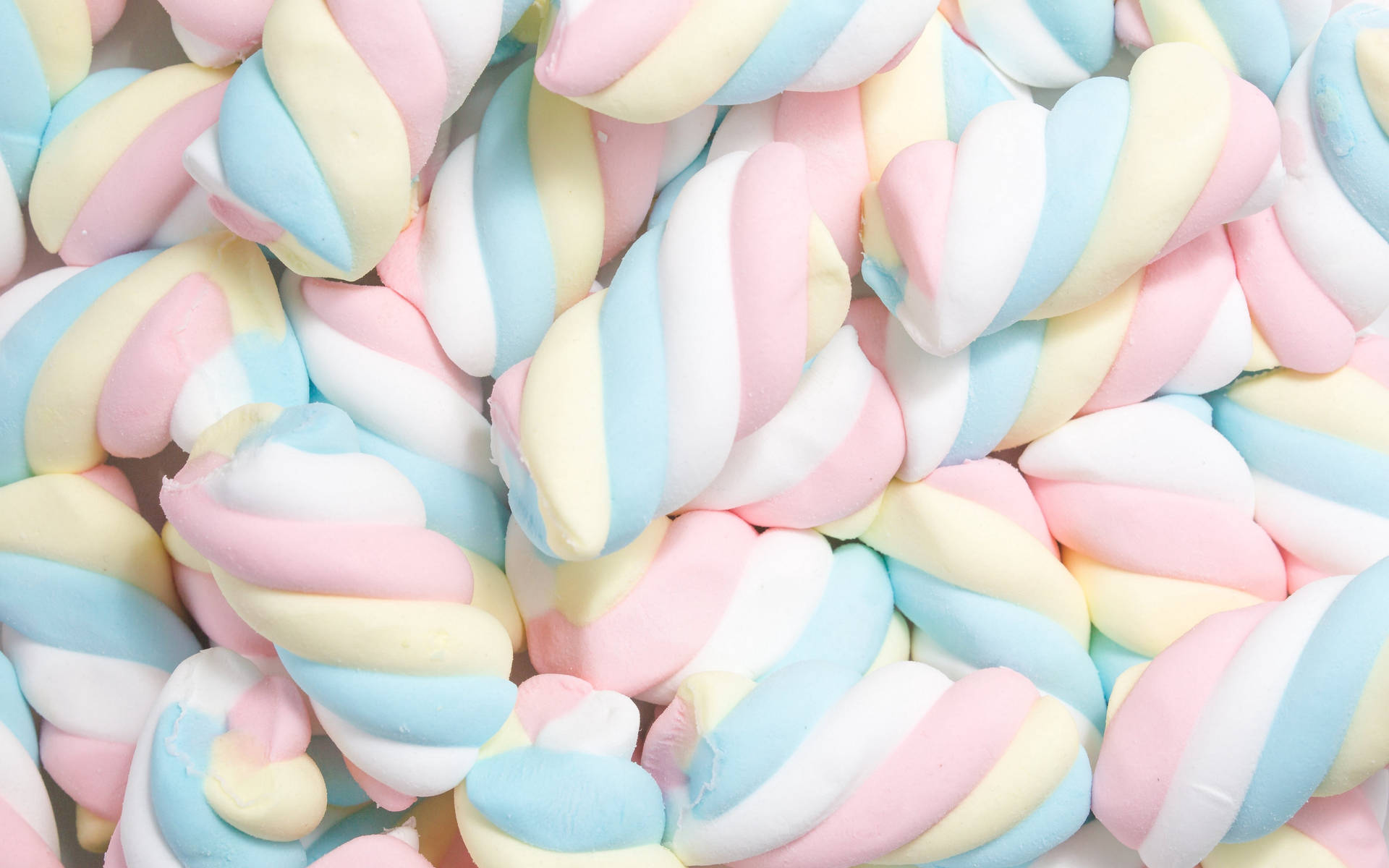 Twisted Fluffy Pastel Marshmallows Background