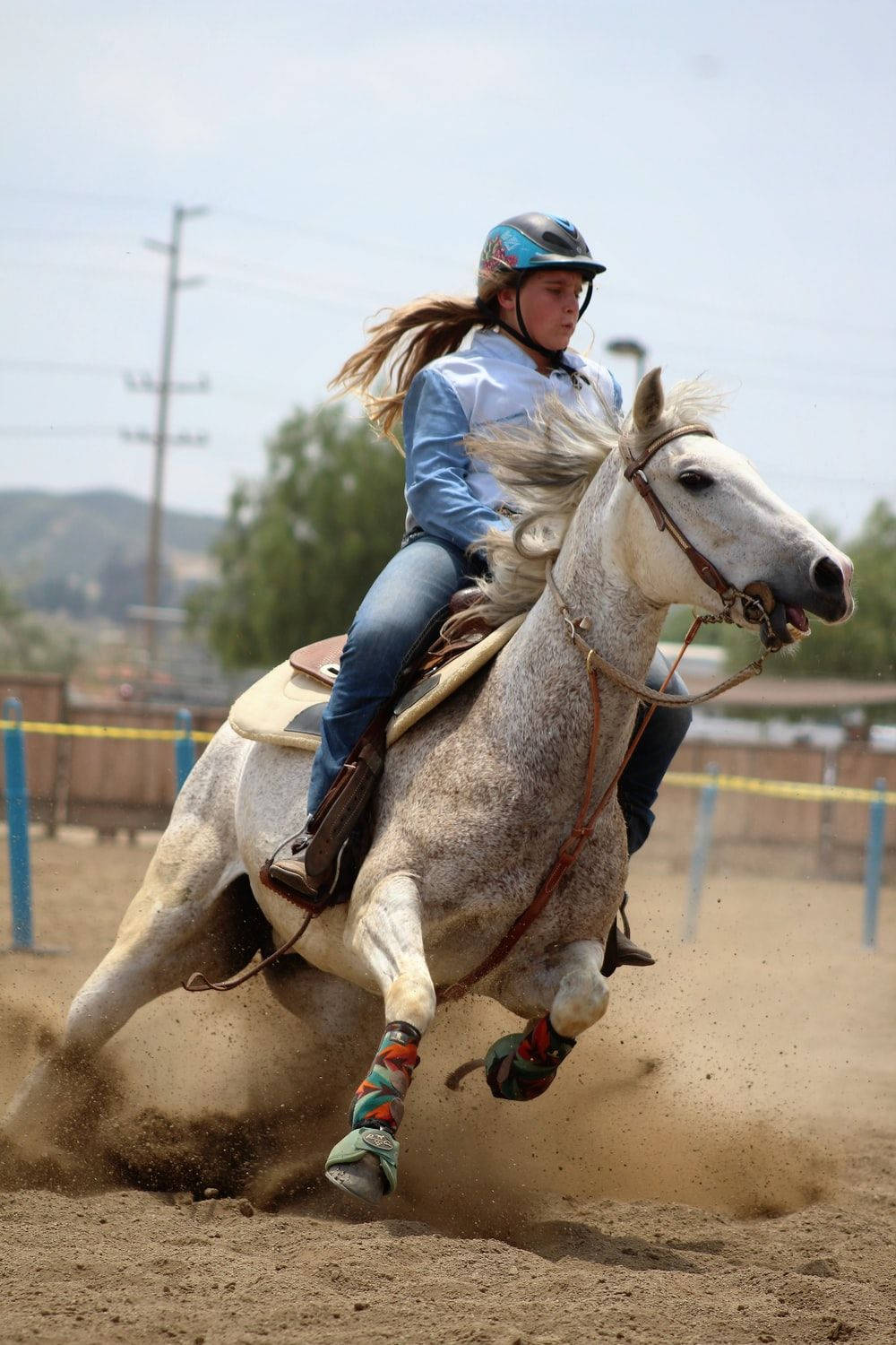 Two Barrel Racers Showing Their Skills At A Rodeo Background