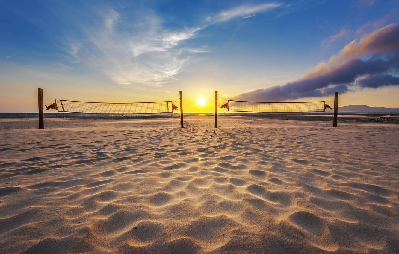 Two Beach Volleyball Nets At Sunrise Background