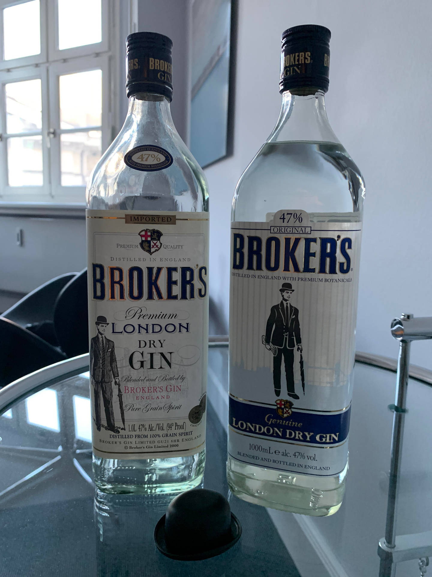 Two Bottles Of Brokers Premium Gin Background