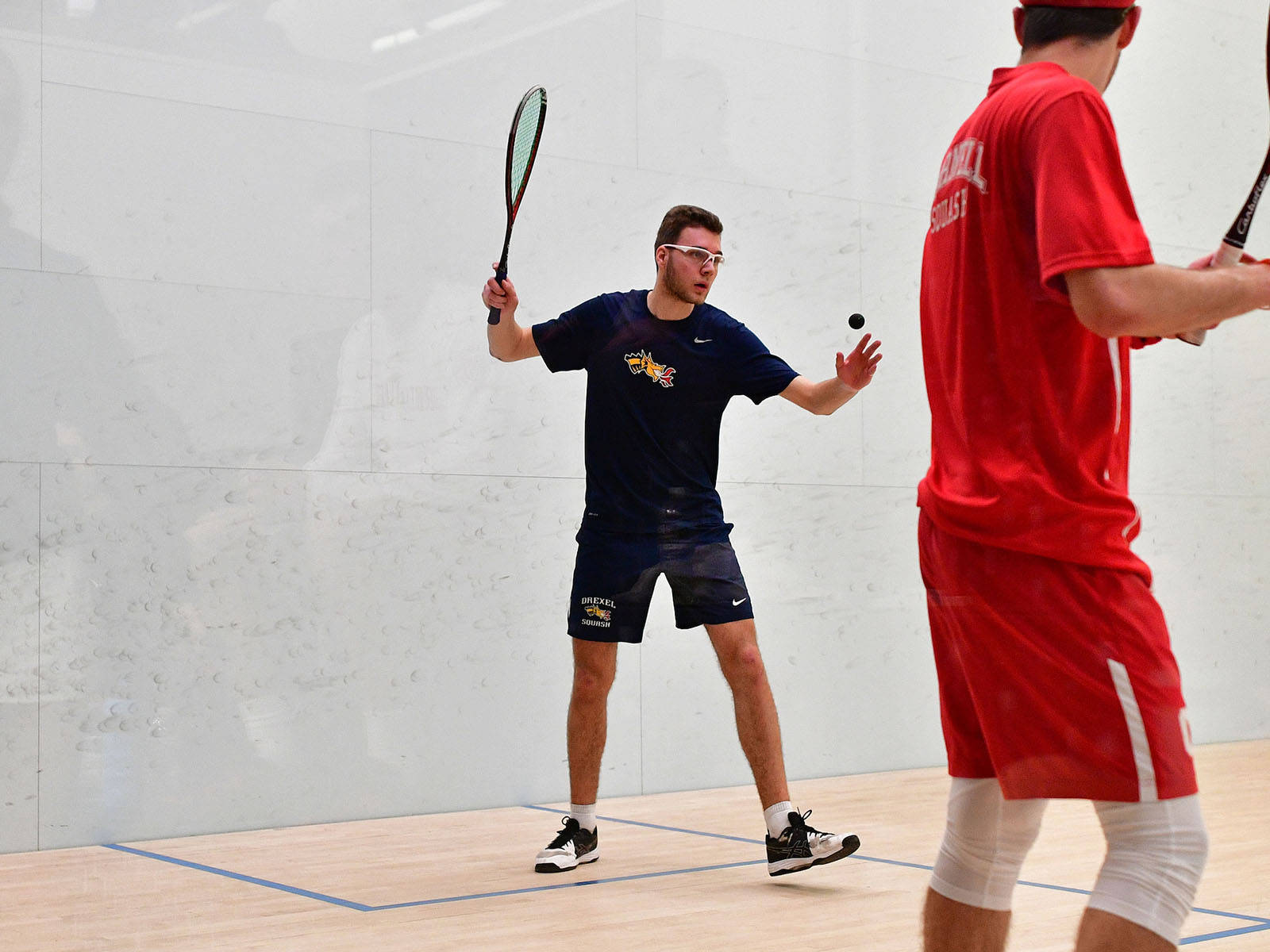 Two Boys In Squash Room