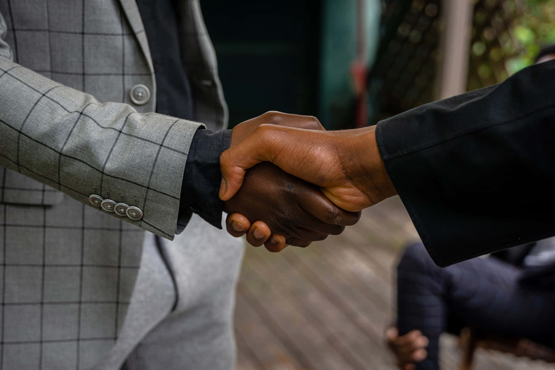 Two Businessmen Engaging In Negotiations Background