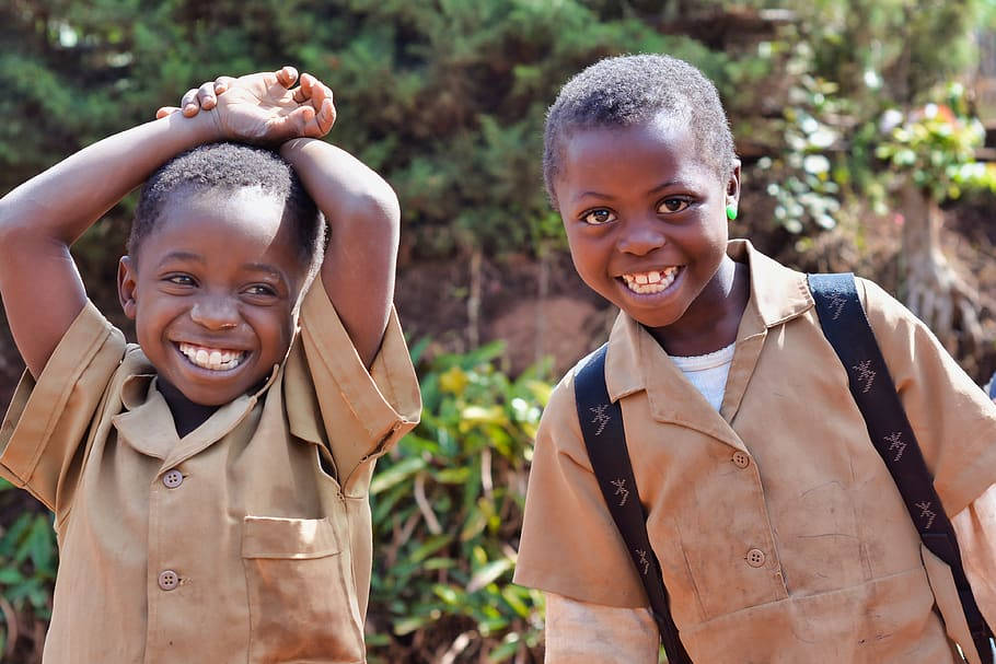 Two Cameroon Boys Smiling Brightly Background