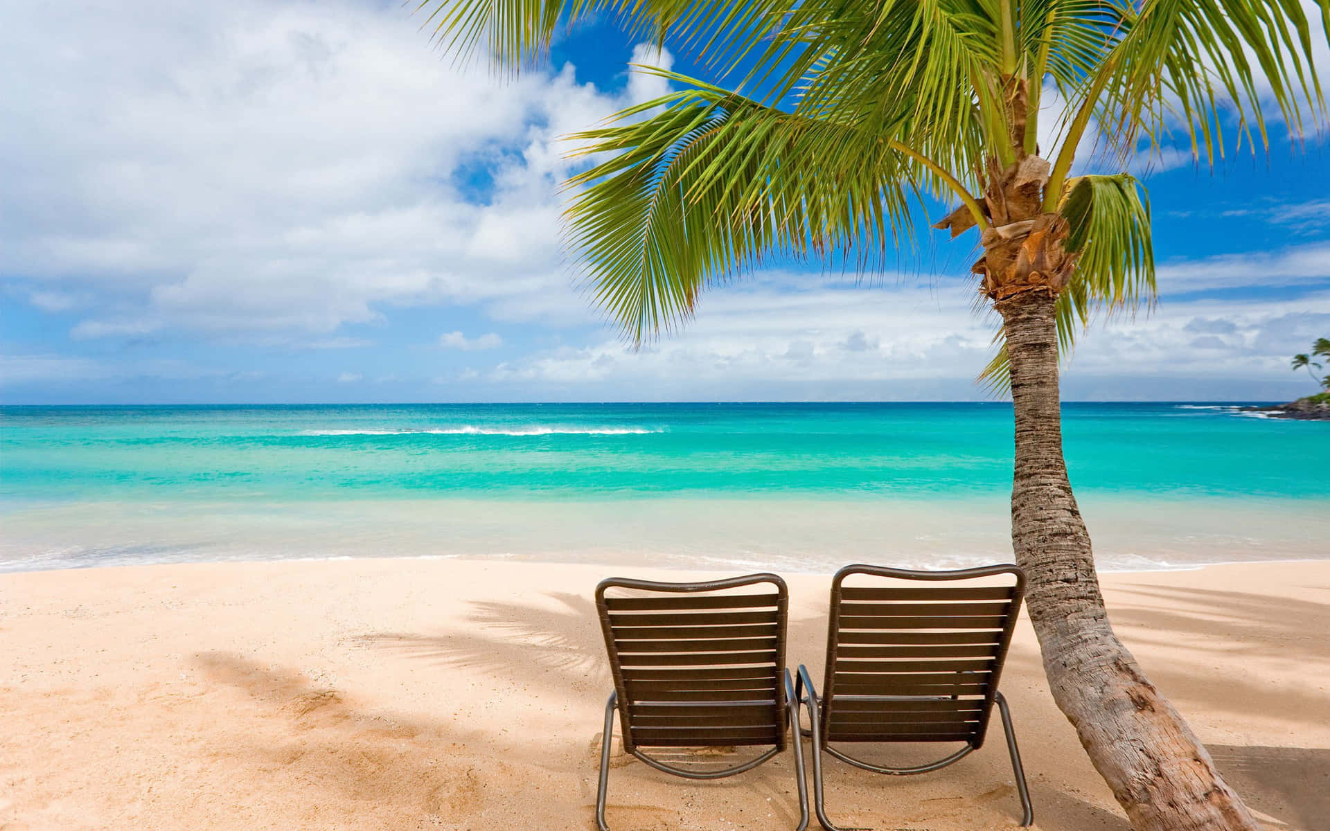 Two Chairs On A Beach Background