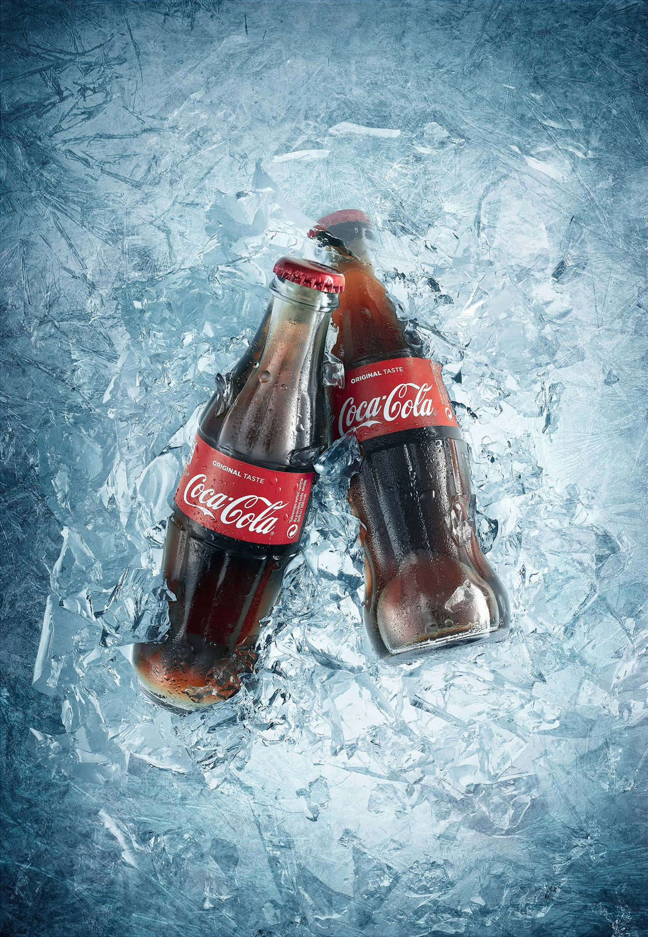 Two Coca Cola Bottles On Ice