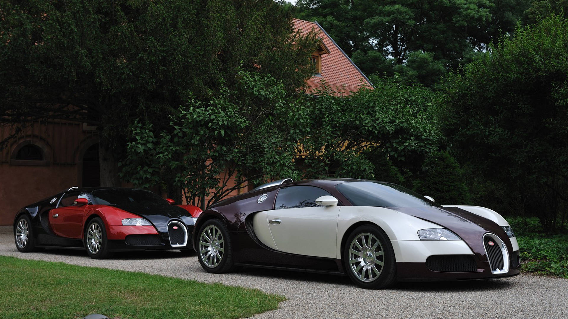 Two Cool Bugatti Cars Parked Background