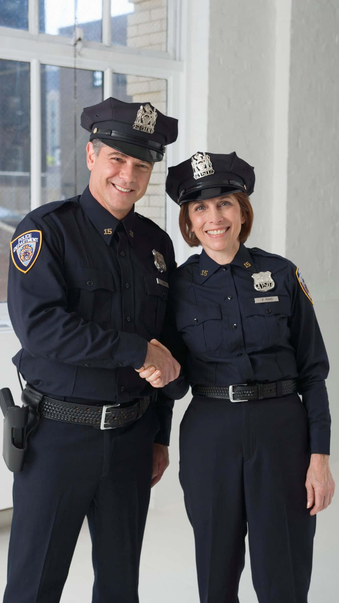 Two Cop Smiling And Shaking Hands