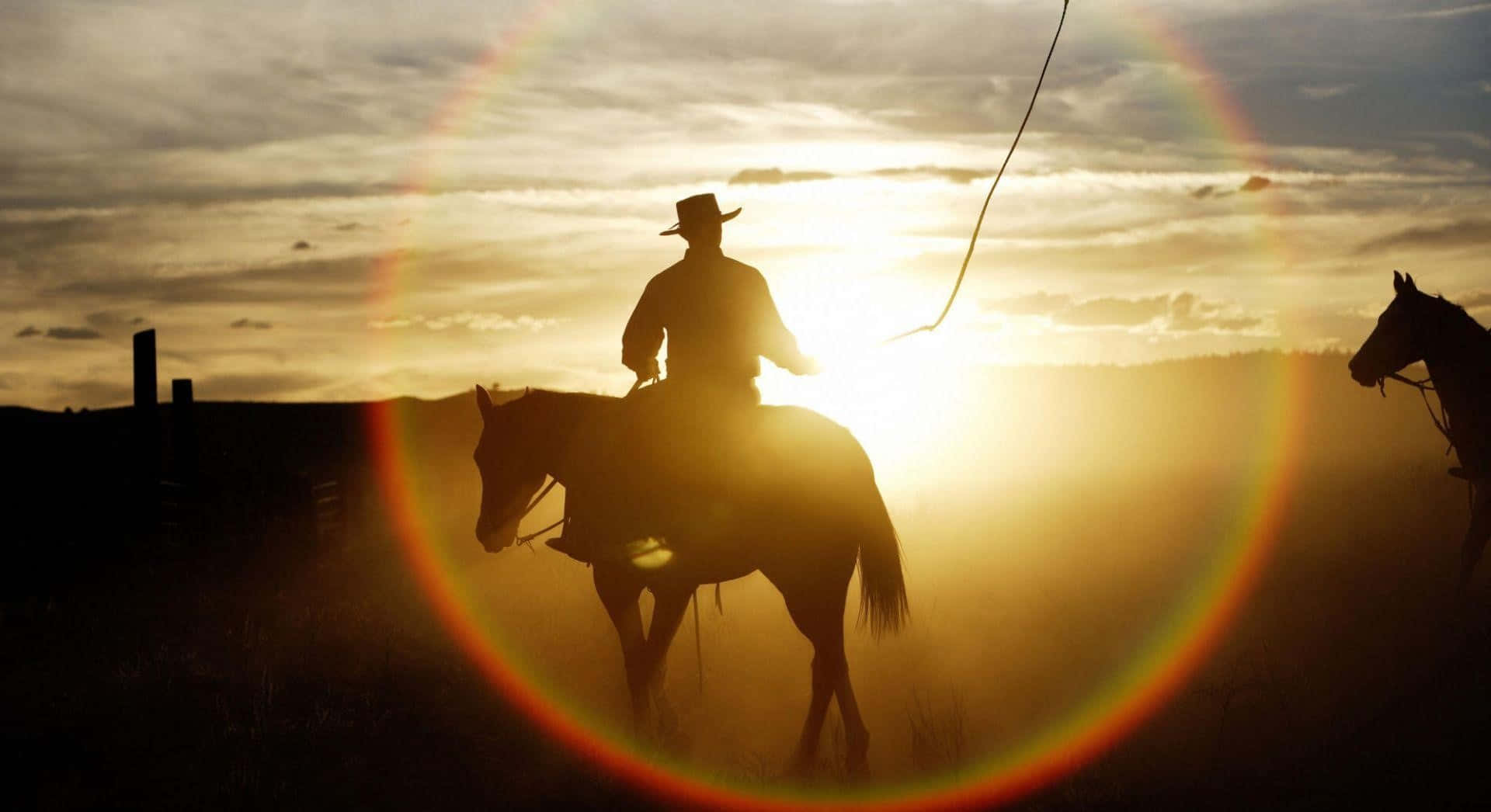 Two Cowboys Riding Horses In The Sunset Background