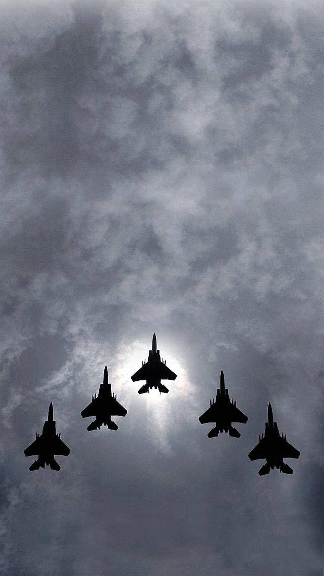 Two F-18 Fighters Soar Into The Sky Background