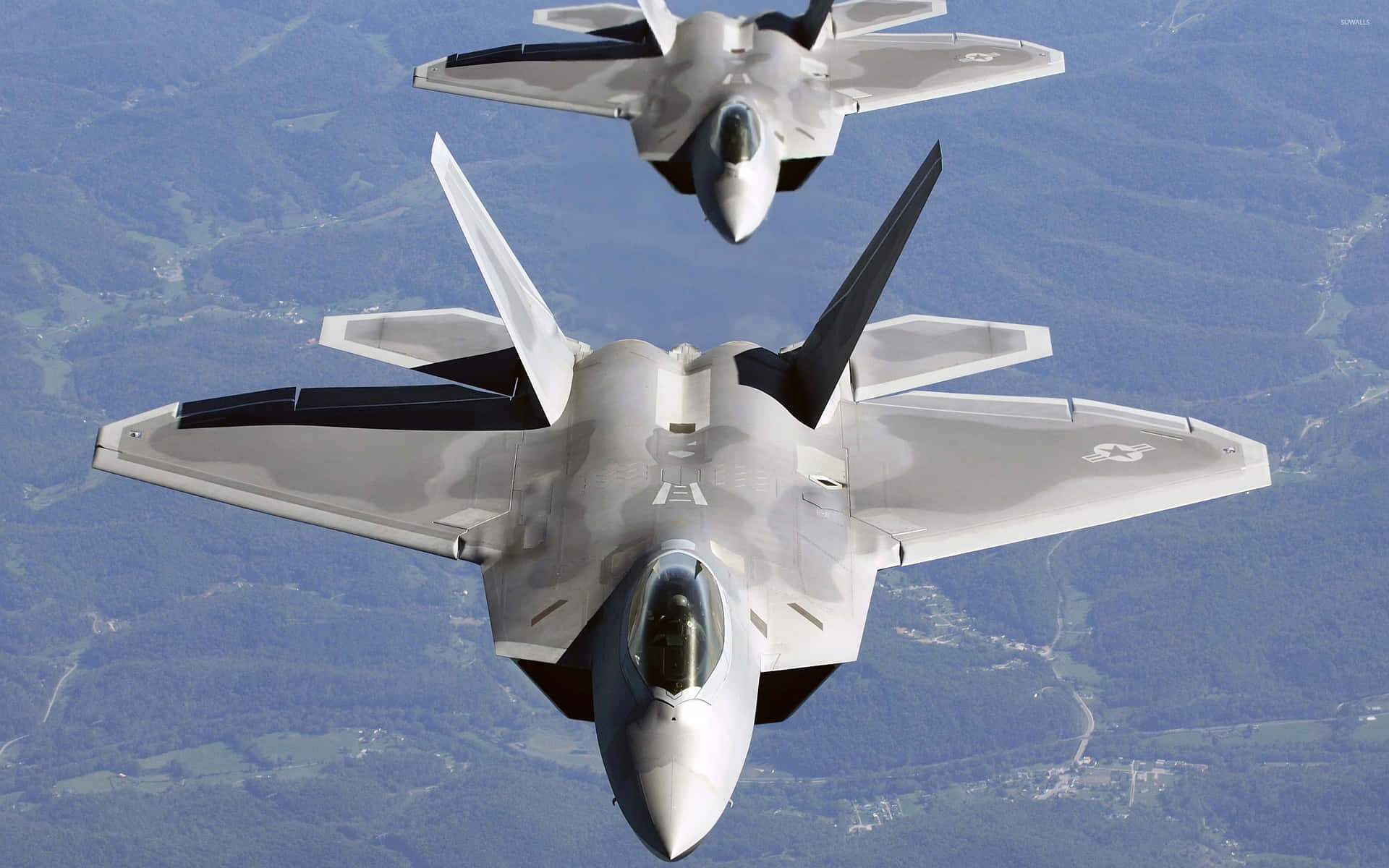 Two Fighter Jets Flying In The Sky Background