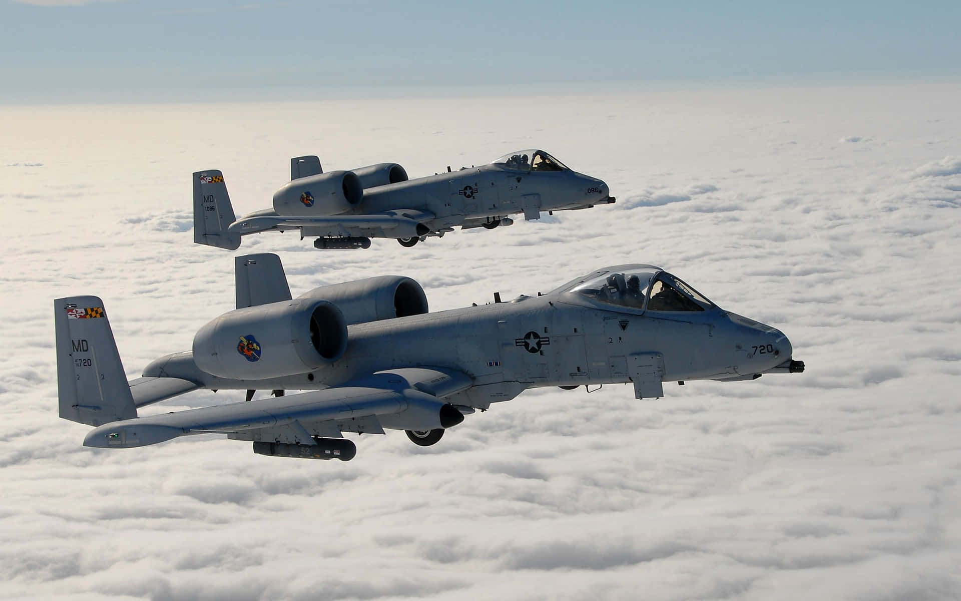 Two Fighter Jets Flying In The Sky Background