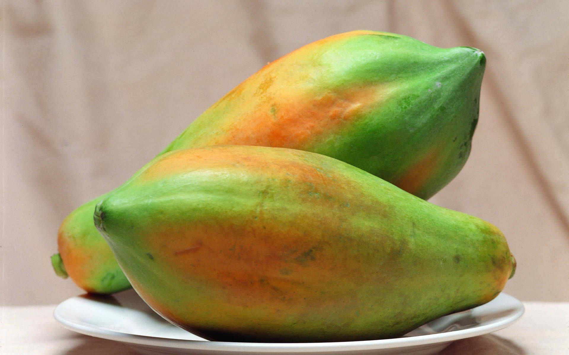 Two Fresh Papaya Fruits Background