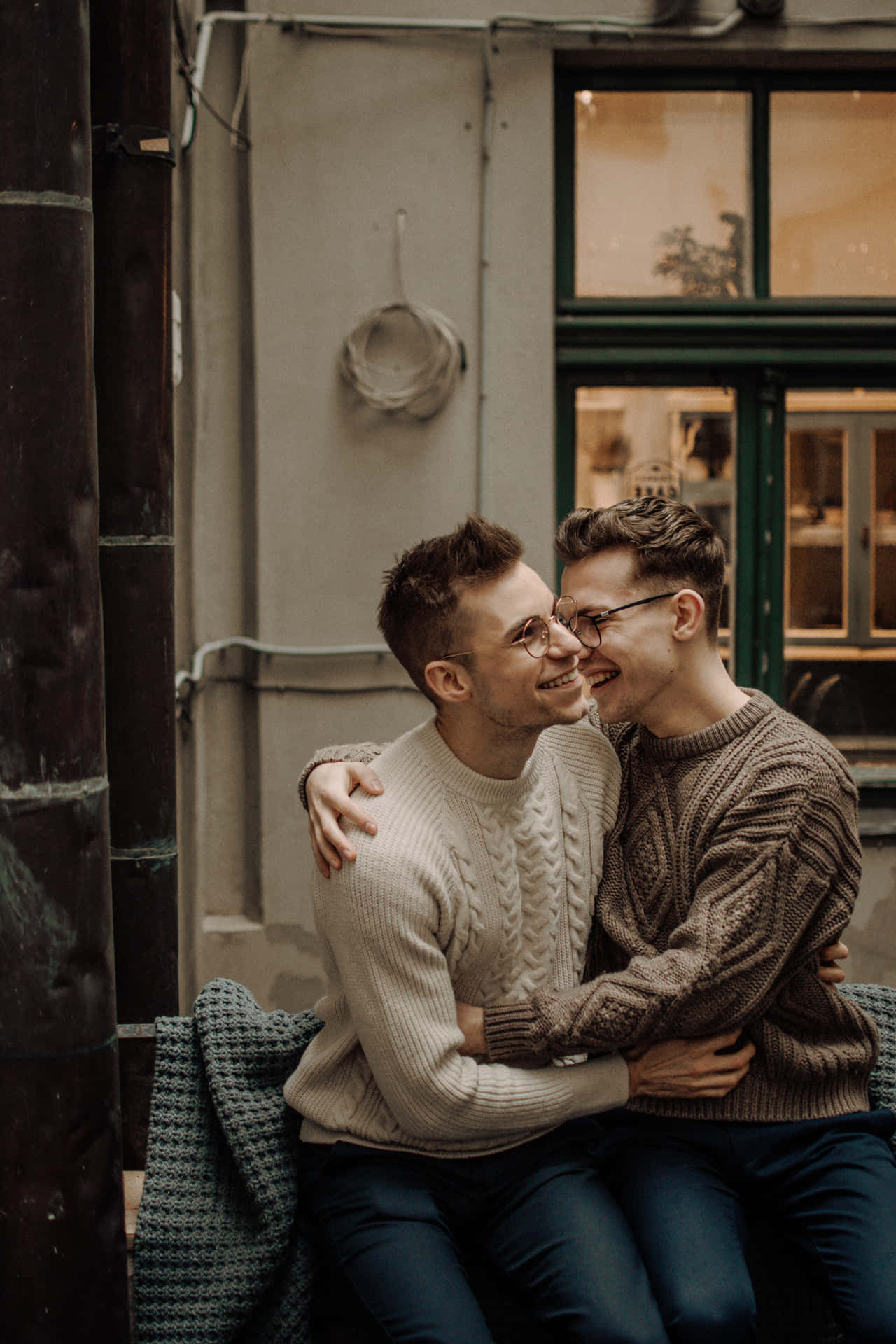 Two Friends Sharing A Joyful Moment Background