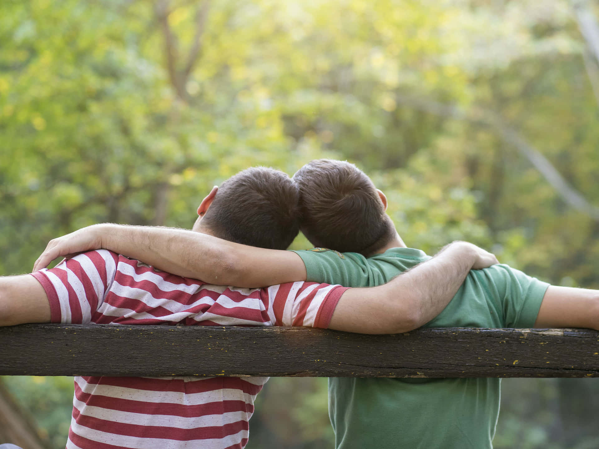 Two Gay Boys Leaning On Each Other Background